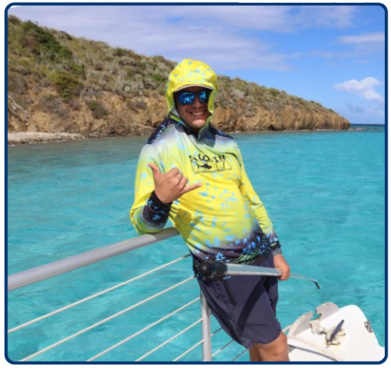 a man standing next to a body of water