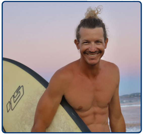 a man standing in front of a beach